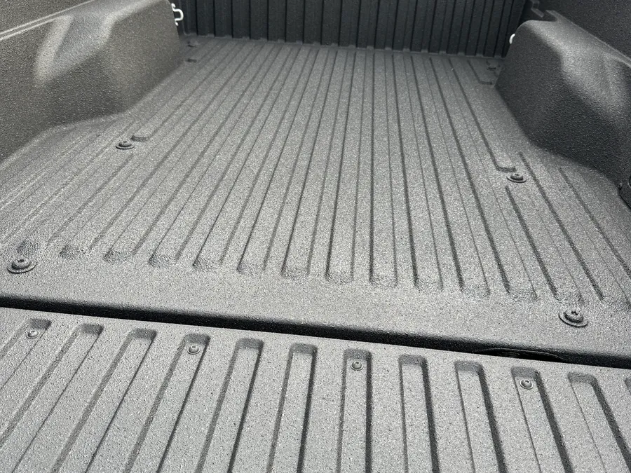 Sprayed-in truck bed liner, finished texture